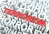 Chilling Terror Plot Foiled at University The word TERRORISM in bold red letters surrounded by related terms in white