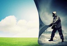 A person in a gas mask pulling back a curtain revealing a polluted cityscape