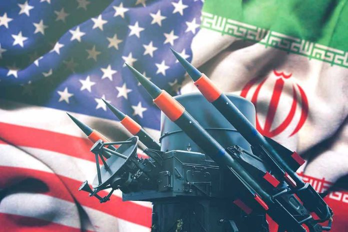 1628170834 Iran and USA flags with missile launcher.