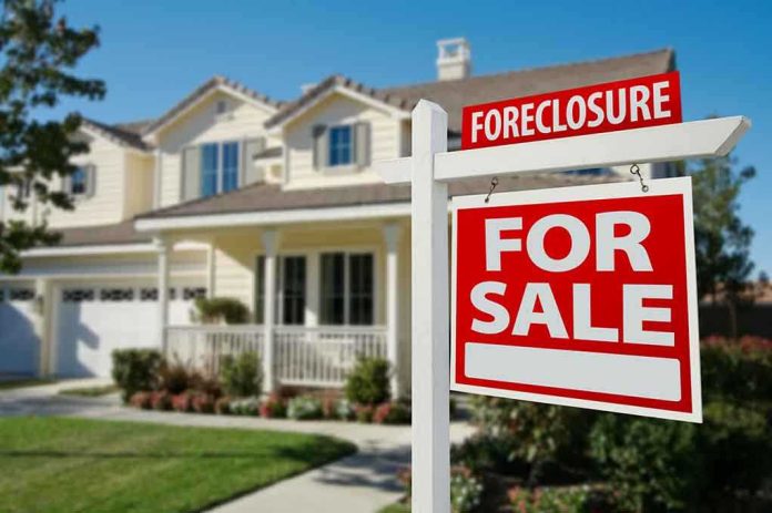 shutterstock_50097061.jpg Foreclosure sign in front of a house for sale