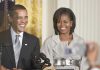 Obama Takes Shot at ESPN’s Biggest Star Former President Barack Obama and Michelle Obama smiling at a public event
