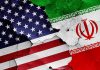 Hidden Pentagon Moves – Headed For Iran Ground War? Cracked American and Iranian flags on a wall.