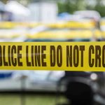 Teen STOCKPILES Weapons — Neo-Nazi Network EXPOSED Yellow police line tape with Do Not Cross.