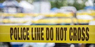 ILLEGAL Slaughters Newlywed Weeks After Wedding Yellow police line tape with Do Not Cross.