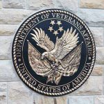 Deadlier Than War: VA’s Hidden Crisis Department of Veterans Affairs seal on brick wall.