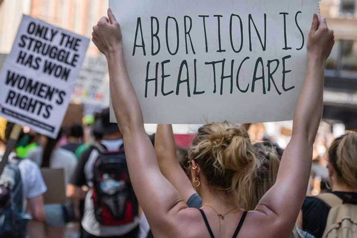 2172202723 Protestors holding signs about womens rights and healthcare.