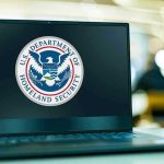 Mass Data Grab Sparks NHS Fury Laptop displaying U.S. Department of Homeland Security logo.