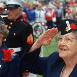 Honor Heroes FIRE BACK—CBS Question Sparks Outcry Elderly women in military attire saluting during a veterans ceremony
