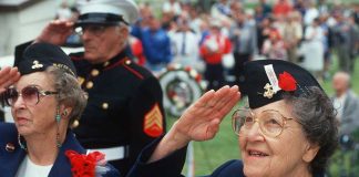 Honor Heroes FIRE BACK—CBS Question Sparks Outcry Elderly women in military attire saluting during a veterans ceremony