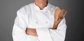 Cancer-Causing Chemicals Lurking in Your BBQ A chef in a white uniform holding wooden cooking utensils with crossed arms