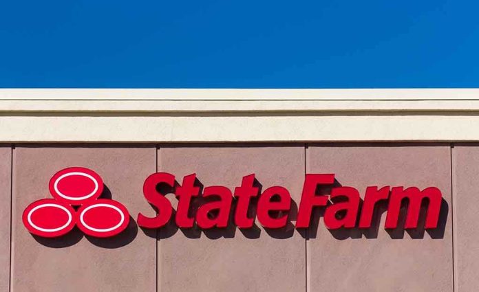 shutterstock_237036724 State Farm logo displayed on a building against a blue sky