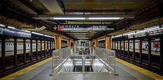 Penn Station Mayhem Sparks Safety Panic Subway station platform with directional signs overhead.