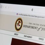 Close-up of the U.S. Department of Justice website on a computer screen