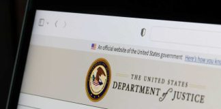 Digital ID Demands: Work Without Papers? Close-up of the U.S. Department of Justice website on a computer screen