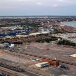 Covert Israel Move Near Red Sea Aerial view of coastal port and town with container yard