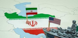 Pence Warns: Don’t Stop Halfway A map of Iran with flags of Iran and the United States and a toy military ship
