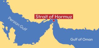 Strait Reopened? Trackers Show Near-Zero Traffic Map highlighting the Strait of Hormuz between the Persian Gulf and Gulf of Oman
