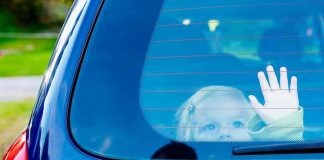 Hot-Car Horror Outside Wingstop Child waving from the back window of car.