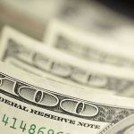 $250 For 25 Million American Children! Close-up of hundred-dollar bills.