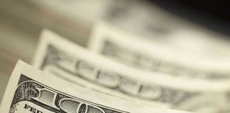 $250 For 25 Million American Children! Close-up of hundred-dollar bills.