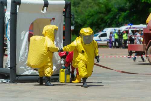 shutterstock1127681561jpg Hazmat-suited workers exit a decontamination tent