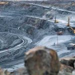 What Trump’s New Export Authority Actually Does Open-pit mine with haul trucks and excavators on terraced roads