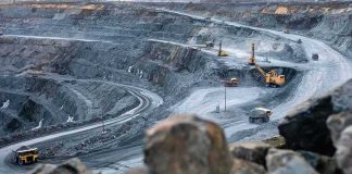 What Trump’s New Export Authority Actually Does Open-pit mine with haul trucks and excavators on terraced roads