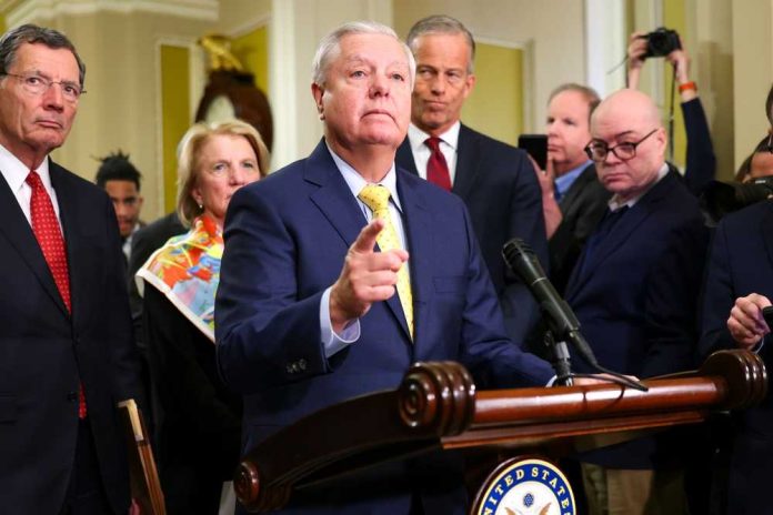 A group of government officials at a press conference with one speaking into a microphone