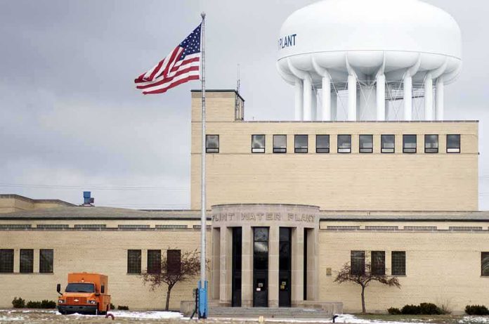 Water treatment plant with US flag and large white water tower