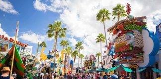 Parents Clash Over Drag at Busch Gardens Crowd walking through a cartoon-themed amusement park street