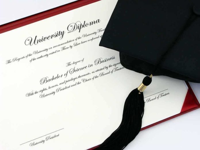 Graduation cap and diploma on a red folder
