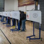 DHS Surge Backfires — Nevada Numbers Crater Voters at polling booths in a gymnasium