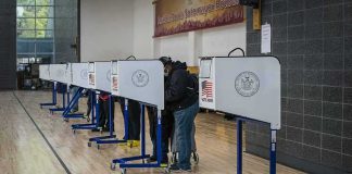 DHS Surge Backfires — Nevada Numbers Crater Voters at polling booths in a gymnasium