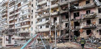 Ballistic Hell Hits High-Rises in Ukraine Damaged apartment building behind a playground slide