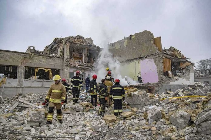 shutterstock_2132623665 Firefighters search rubble of a partially collapsed building