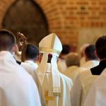 FBI Memo Targets Priests Bishop in white mitre among clergy during church procession
