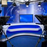 Trump Walks Out, Claims California Rigged A television studio setup with cameras and a blue backdrop