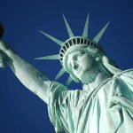 CIA Just Dropped Dozens of Secret 9/11 Files Statue of Liberty holding torch against clear blue sky
