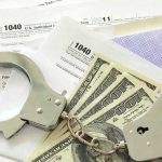Trump Administration Makes UNPRECEDENTED Extradition Move Handcuffs on tax forms with cash
