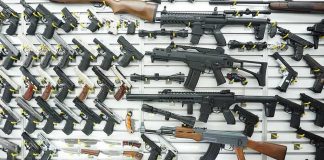 Wall display of assorted firearms in a gun shop