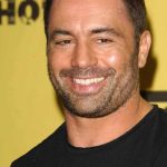 Joe Rogan Wants AI to Run the Government Smiling man with short hair and stubble