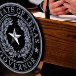 Texas GOP Civil War Explodes Texas governor seal on wooden podium