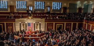 House chamber filled with lawmakers during a session