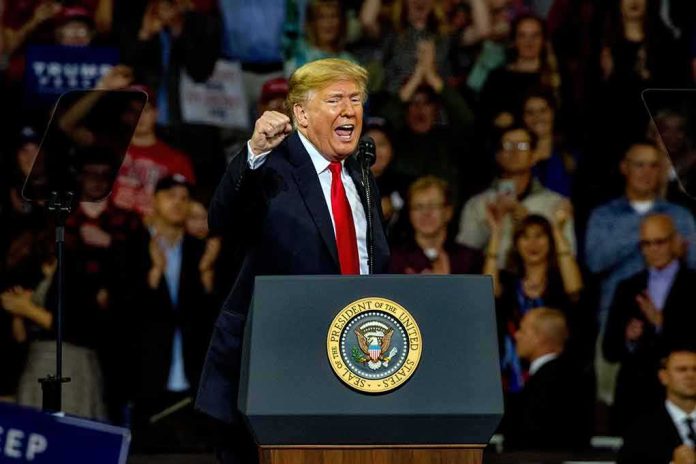 shutterstock_1204270459 Donald Trump speaking at a rally behind a presidential podium