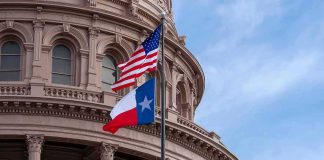 Texas Driver Challenges AI-Assisted Police Surveillance and Wins Texas and U.S. flags in front of a capitol building dome