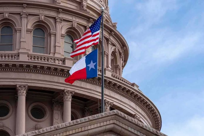 shutterstock_1216088524 Texas and U.S. flags in front of a capitol building dome