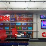 Media Tiptoes Around 9/11 Truth CNN newsroom set with red chairs and multiple TVs