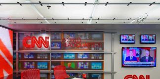 Media Tiptoes Around 9/11 Truth CNN newsroom set with red chairs and multiple TVs
