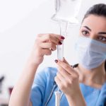 Cancer Treatment Americans Can’t Get Is Turning Heads Overseas Healthcare worker adjusting IV drip line