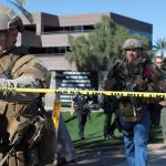 50 U.S. Troops Join Massive Dawn Raids Overseas Tactical police officers behind yellow caution tape at an outdoor scene
